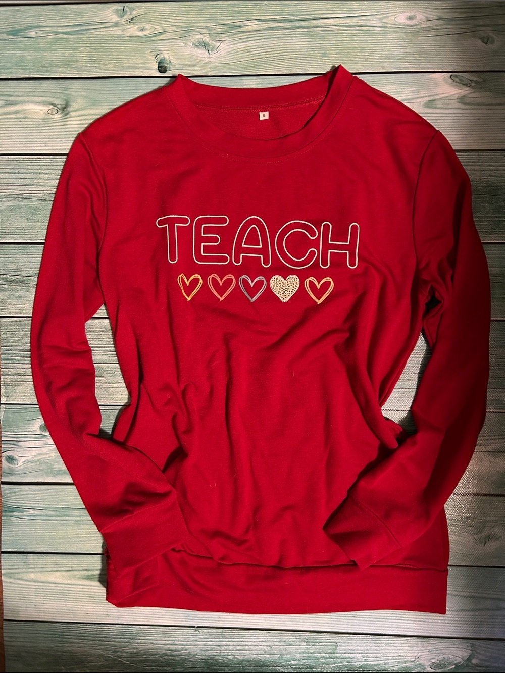 Women’s Red 'Teach' Long Sleeve Sweatshirt
